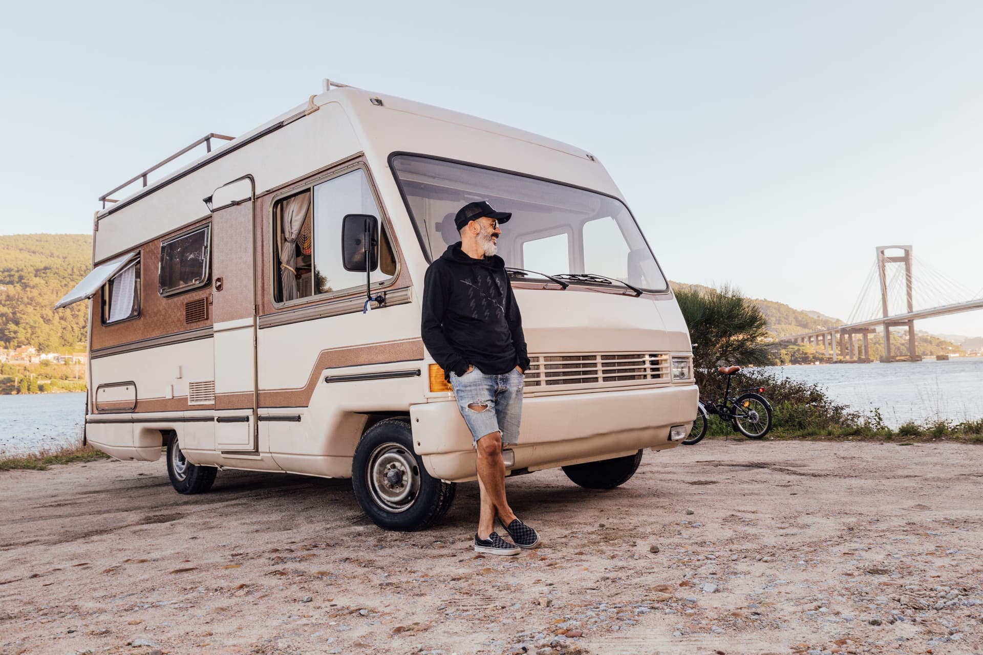 Traveler standing beside a campervan