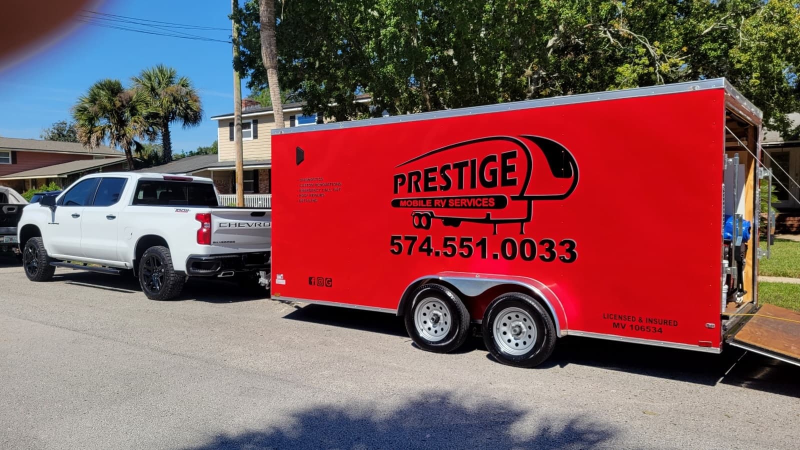 Prestige Mobile RV Services truck and red trailer